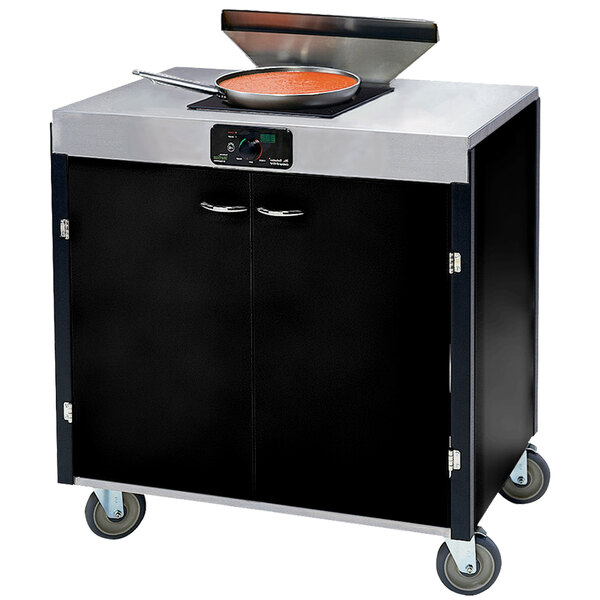 A black and silver Lakeside mobile cooking cart with a pan on top.