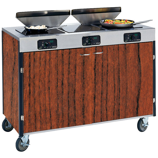 A Lakeside kitchen cart with pans on top of a wood counter.