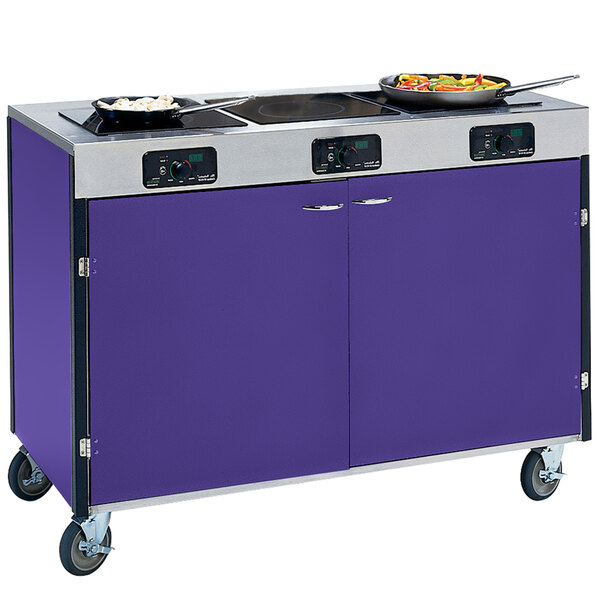 A purple and silver Lakeside mobile cooking cart with three induction burners and pots on them.