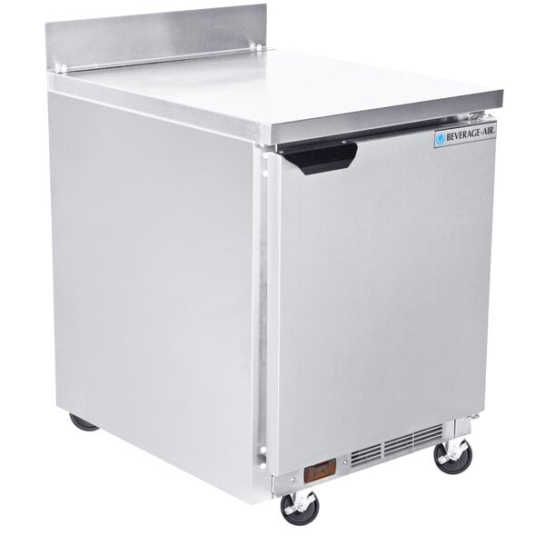 A silver Beverage-Air worktop freezer with wheels.