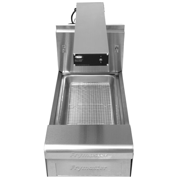 A Frymaster food warmer holding station on a counter with a cafeteria pan on top.