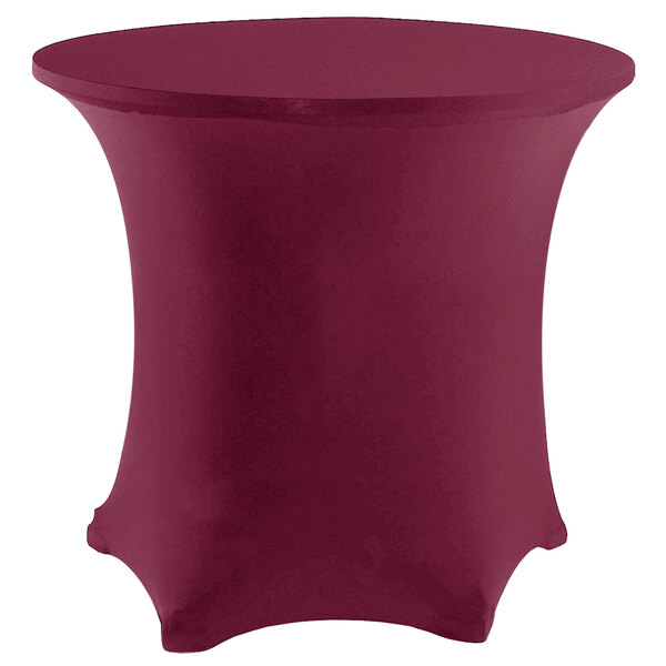 A burgundy Snap Drape Contour table cover on a round table with a white base.