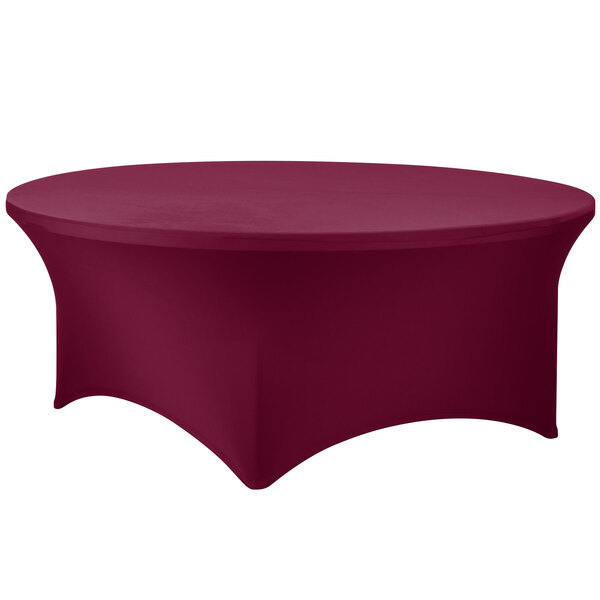 A Snap Drape burgundy spandex table cover with a round shape on a table.