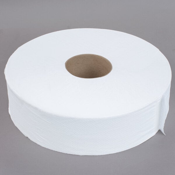 A Response jumbo toilet paper roll with white paper.