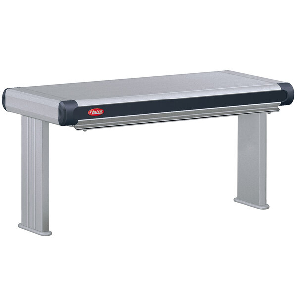A grey rectangular Hatco Glo-Ray infrared strip warmer with black accents on a stainless steel counter.