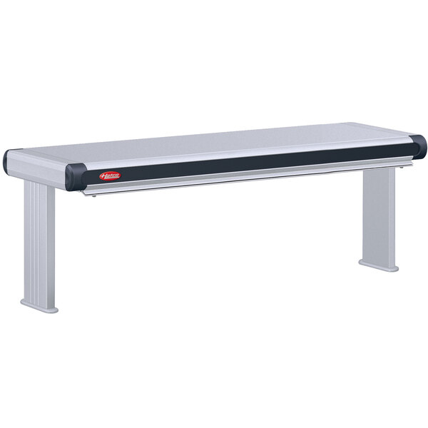 A stainless steel Hatco Glo-Ray designer double infrared strip warmer on a long metal bench.