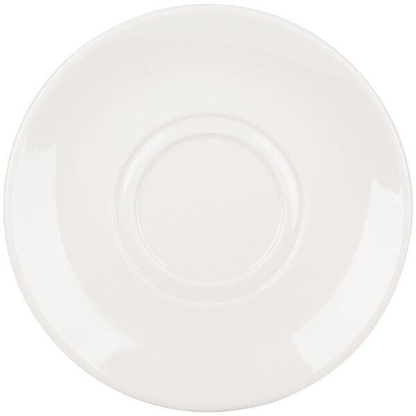 A white saucer with a wide rim and a circular design.