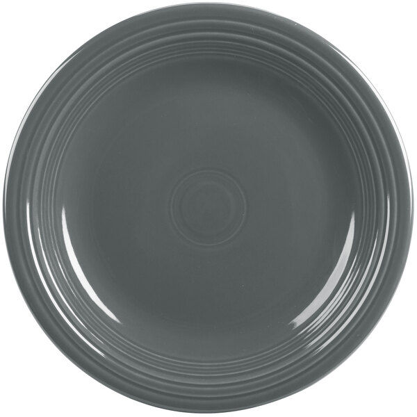 A grey Fiesta dinner plate with a rim.