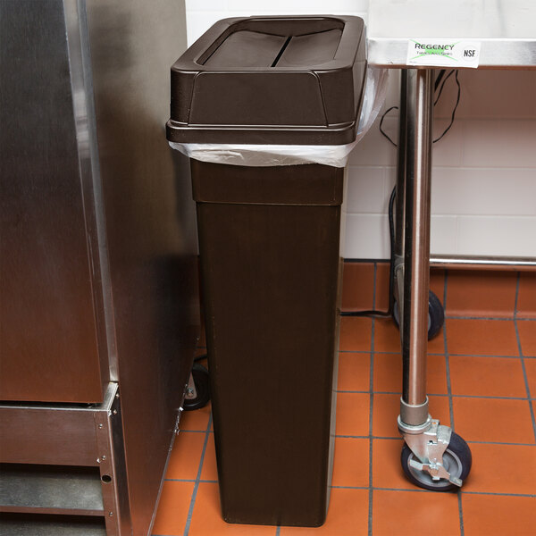 A brown Continental wall hugger rectangular trash can with a brown drop shot lid.
