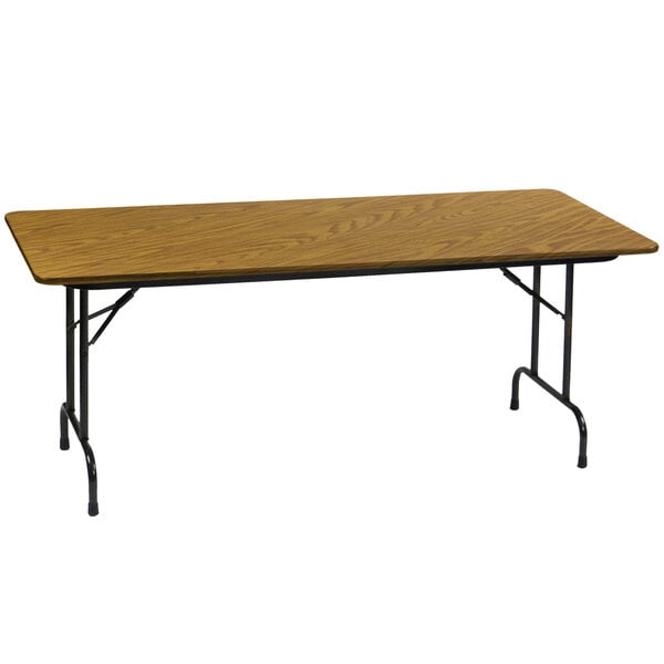 A Correll rectangular wood folding table with black metal legs.