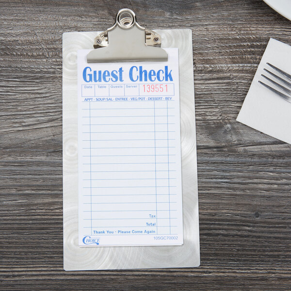 A guest check on a Menu Solutions Alumitique clipboard with a swirl finish.