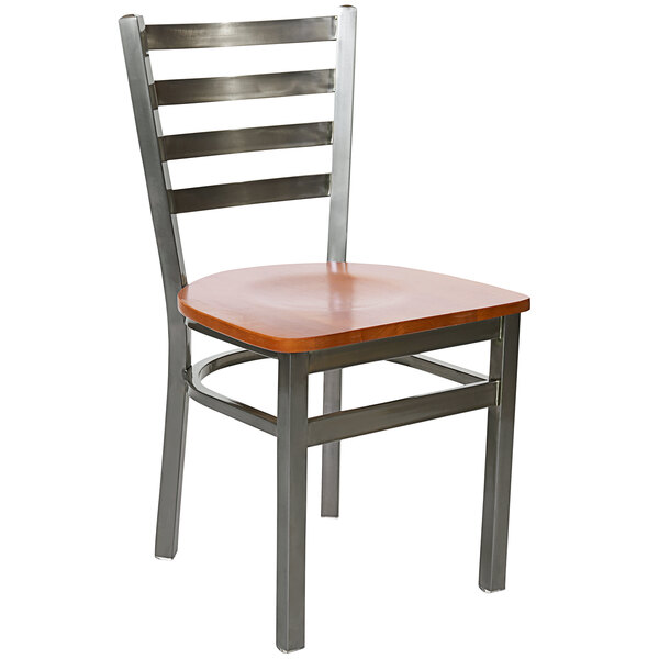 A BFM Seating steel side chair with cherry wooden seat and clear coat frame.