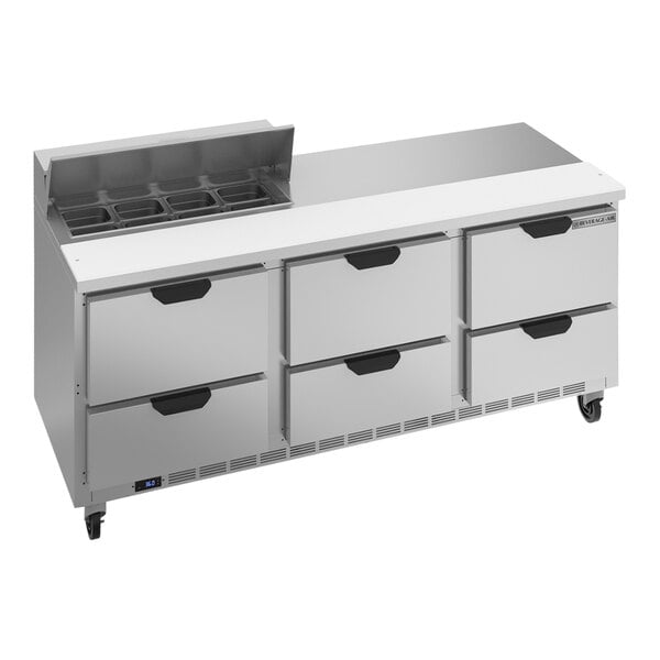 A Beverage-Air sandwich prep table with six drawers on a stainless steel counter.