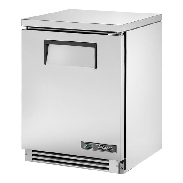 A stainless steel True undercounter refrigerator with an open door.