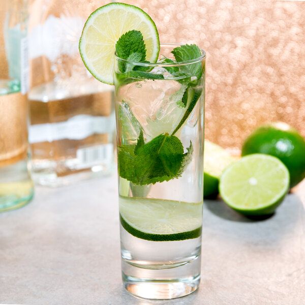 A glass of water with lime and mint in an Arcoroc Islande Collins Glass.