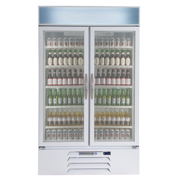 A white Beverage-Air glass door refrigerator filled with bottles of beer.