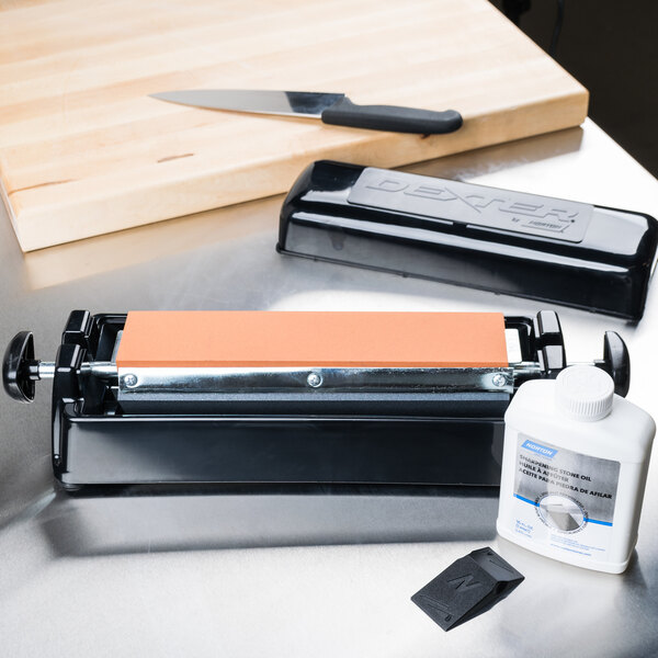 A Dexter-Russell knife sharpener on a counter.