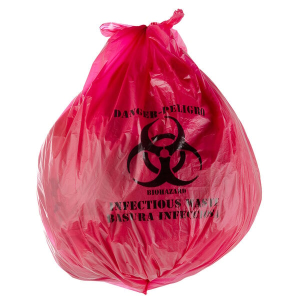 A red plastic trash bag with a biohazard symbol.