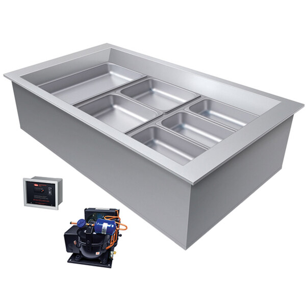 A large rectangular stainless steel Hatco drop-in cold food well with three slanted rectangular trays inside.