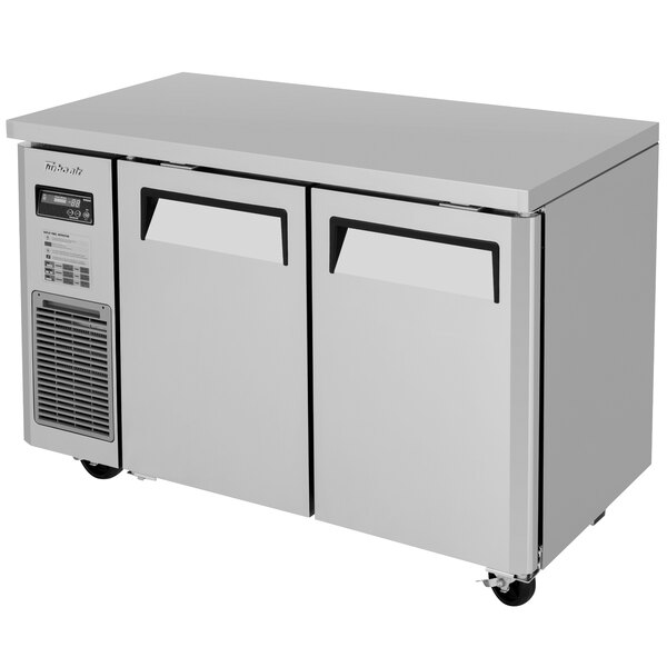 A stainless steel Turbo Air undercounter freezer with two doors.