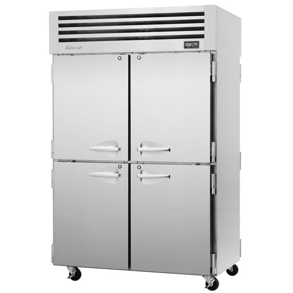 A white Turbo Air reach-in refrigerator with half doors.