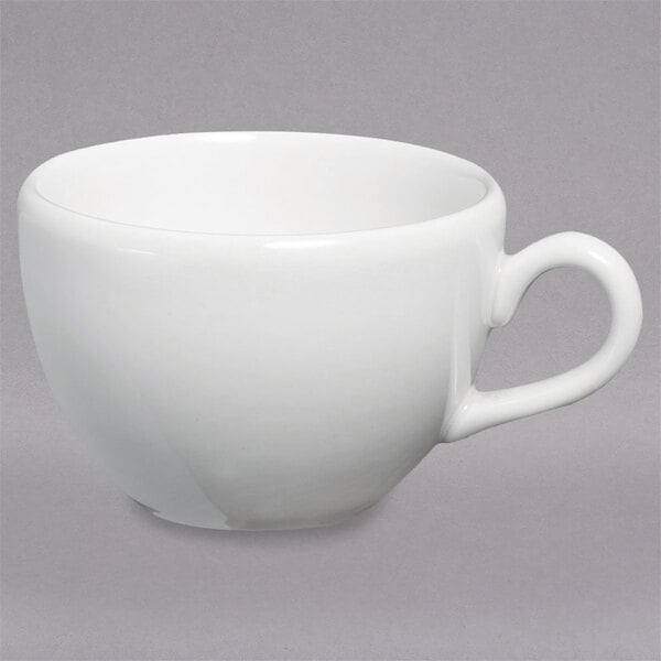 A white Homer Laughlin China tea cup with a handle.