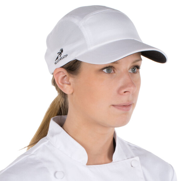 A woman wearing a white Headsweats cap.