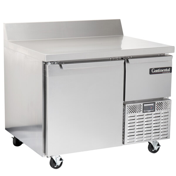A large stainless steel Continental Refrigerator worktop refrigerator with a backsplash.
