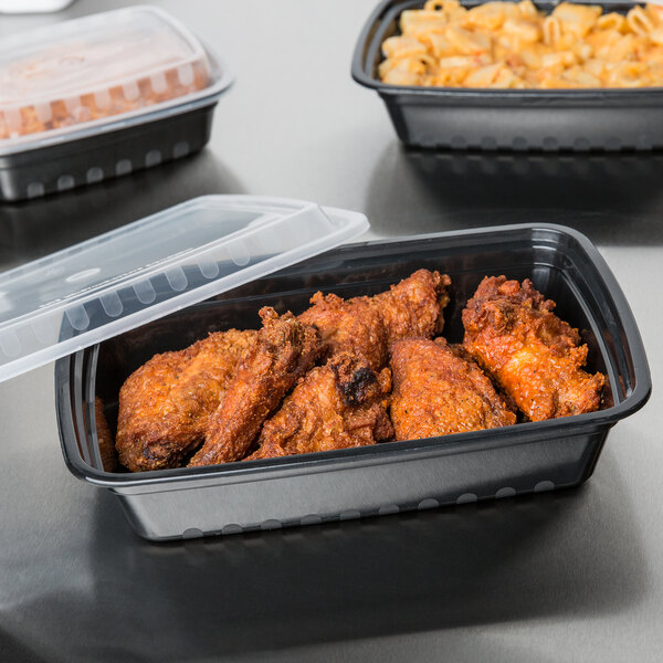 Choice 28 oz. Black 8 3/4" x 6 1/4" x 1 3/4" Rectangular Microwavable Heavy Weight Container with Lid - 150/Case