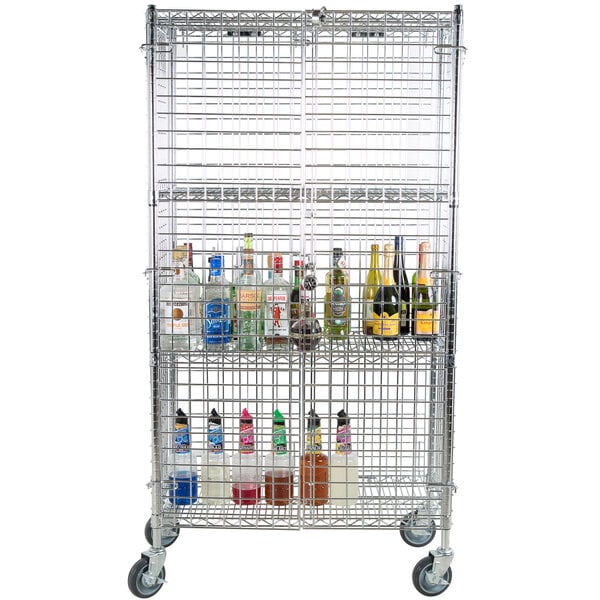 A Regency chrome wire security cage cart filled with bottles of alcohol.