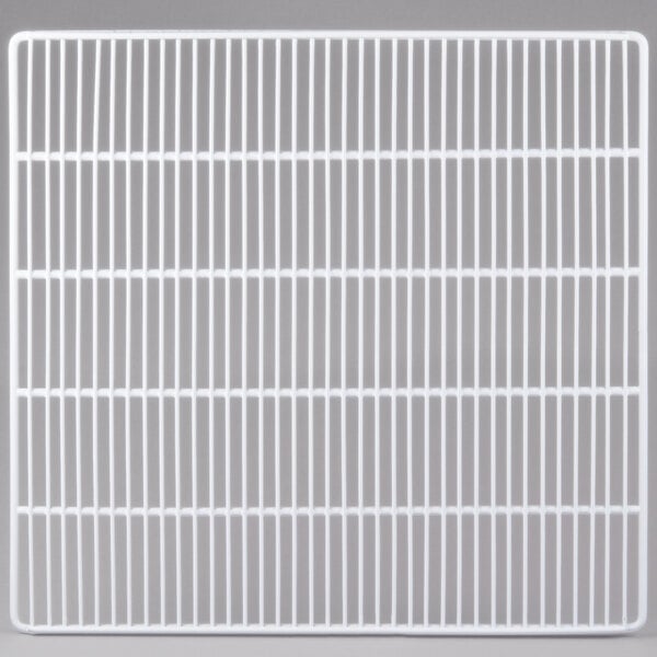 A grey metal grid shelf with a grid pattern.
