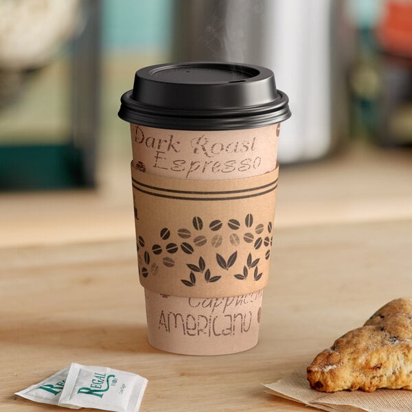 A stack of Kraft paper hot cups with black lids and sleeves.