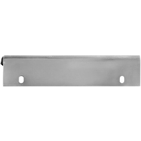 A metal plate with two holes on a white surface.