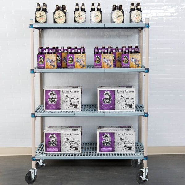 A MetroMax shelf cart with boxes and bottles of beer on it.