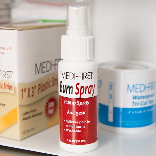 A white pump bottle of Medi-First Burn Spray with red text.