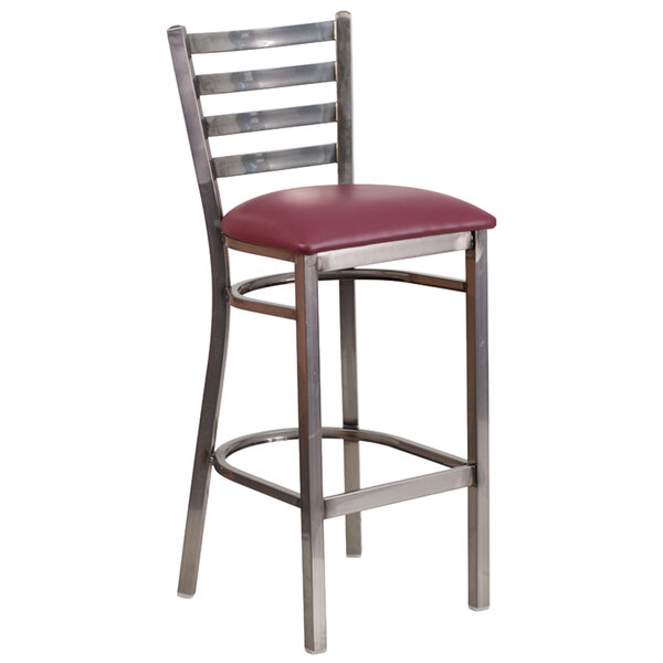 A Clear-coated metal restaurant barstool with a burgundy vinyl seat.