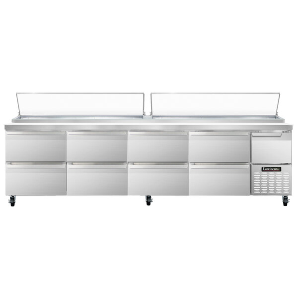 A stainless steel Continental Pizza Prep Table with drawers and doors.