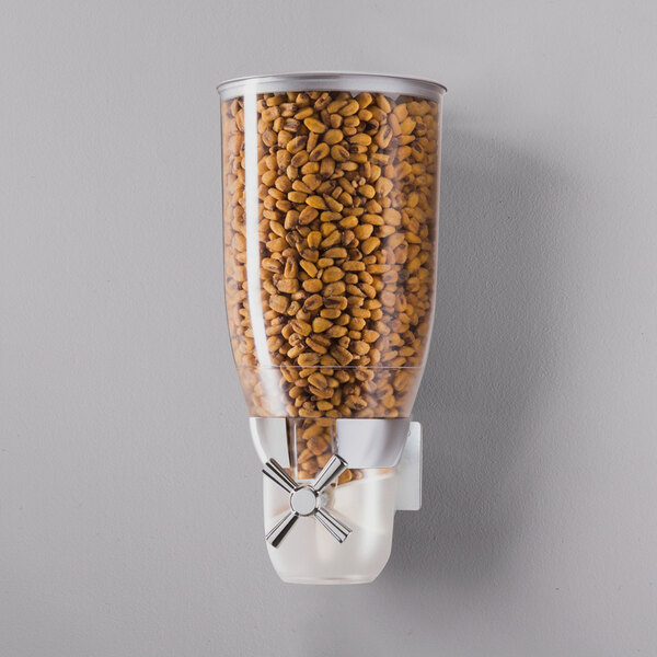 A Cal-Mil wall mounted metal canister filled with food.