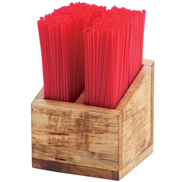 A wooden container with two compartments for red straws.