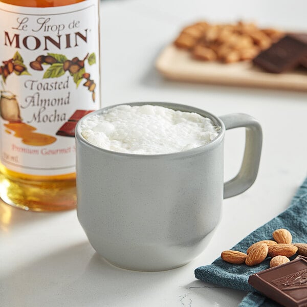Monin 750 mL Premium Toasted Almond Mocha Flavoring Syrup