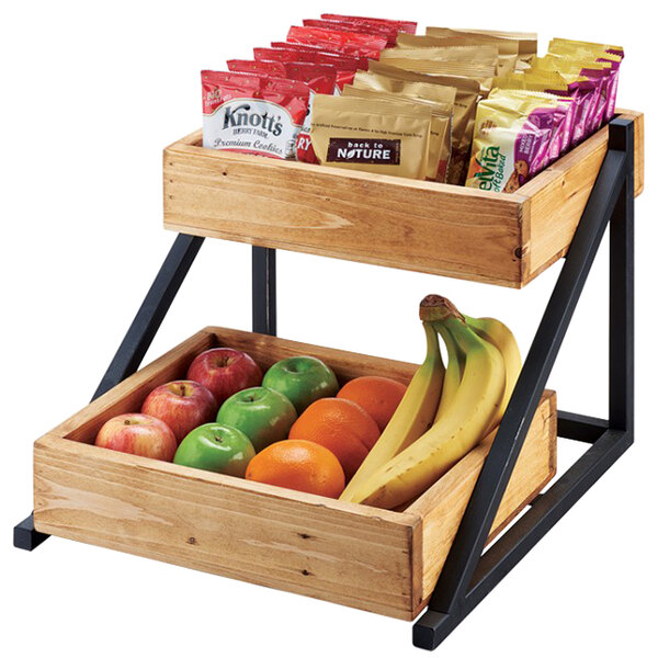 A Cal-Mil Madera 2-tier wooden merchandiser with fruit and snacks on the shelves.