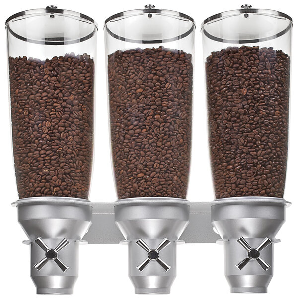 A Cal-Mil wall mount triple cereal dispenser with coffee beans in it.