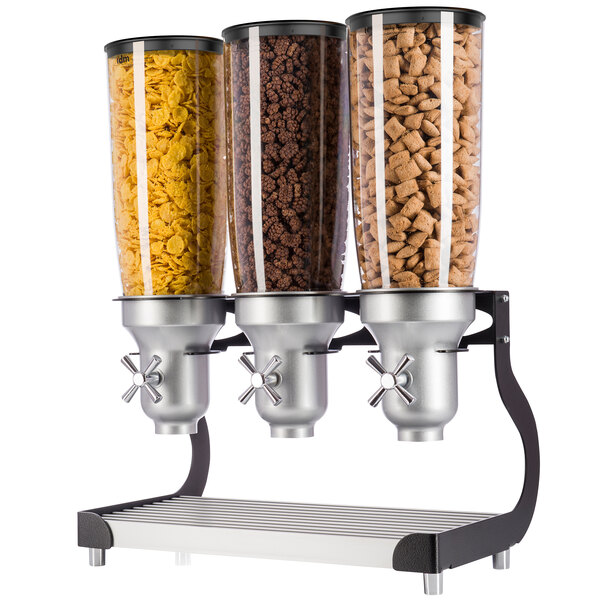 Three black Cal-Mil cereal dispensers with different types of cereal.