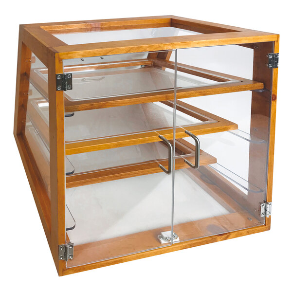 A wooden cabinet with glass doors and three shelves.