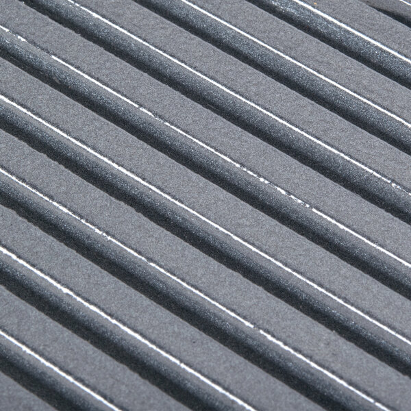 A grey surface with white lines.