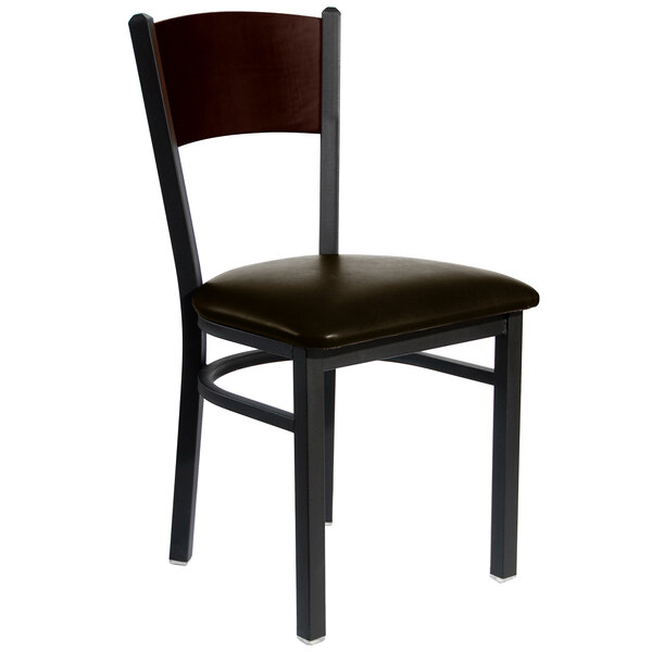 A BFM Seating Dale Sand Black Metal Side Chair with Walnut Finish Wooden Back and Dark Brown Vinyl Seat.