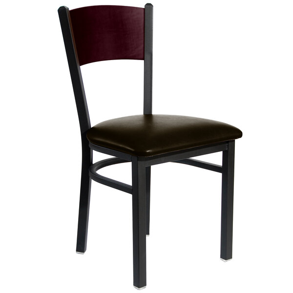 A BFM Seating black metal side chair with a mahogany wood back and dark brown cushion.