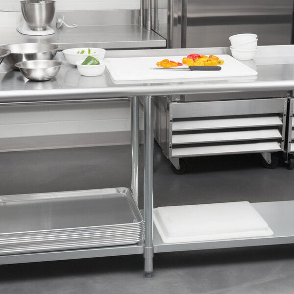 A Steelton stainless steel work table with bowls of food.