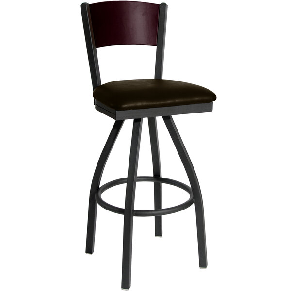 A black metal bar stool with a mahogany wood back and dark brown seat.