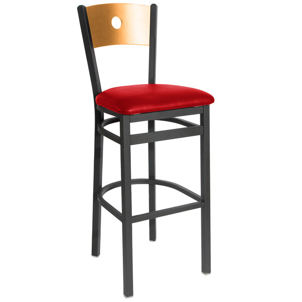 A black metal BFM Seating bar stool with a red vinyl seat.